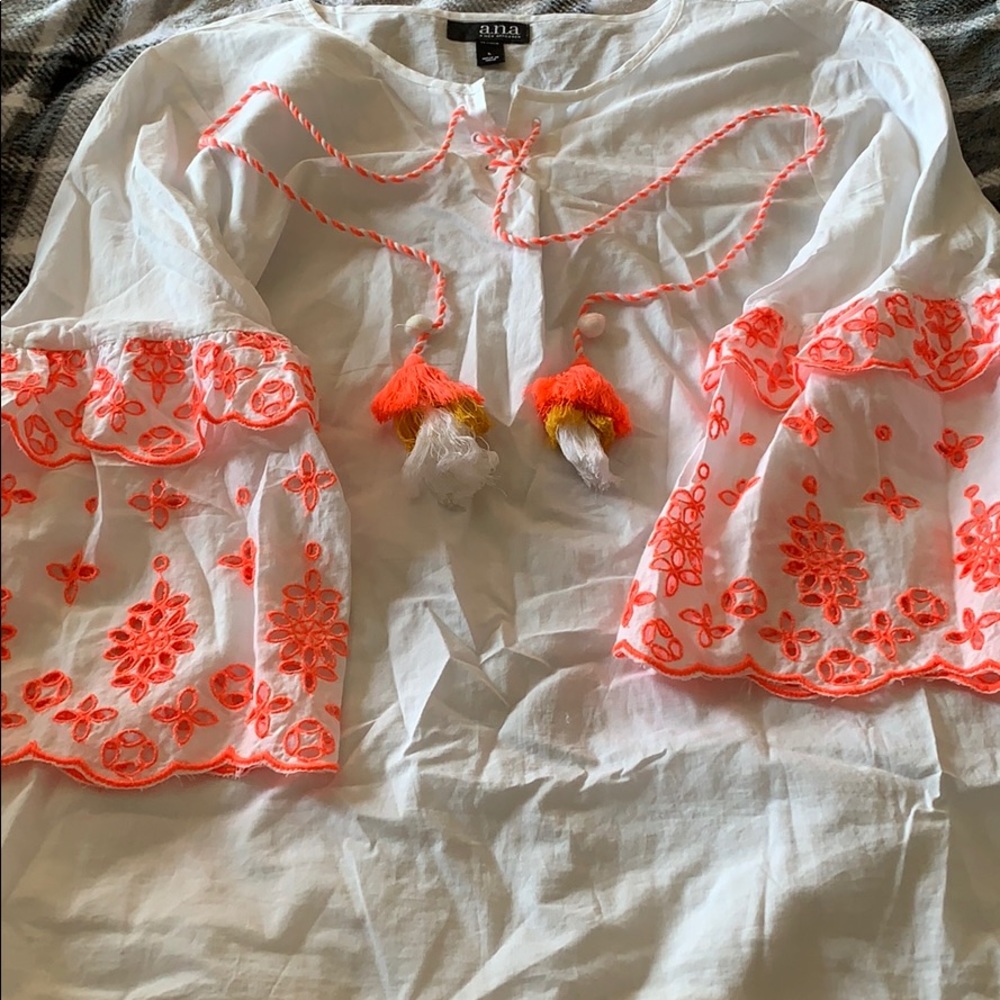 White blouse with coral pink sleeves and strings